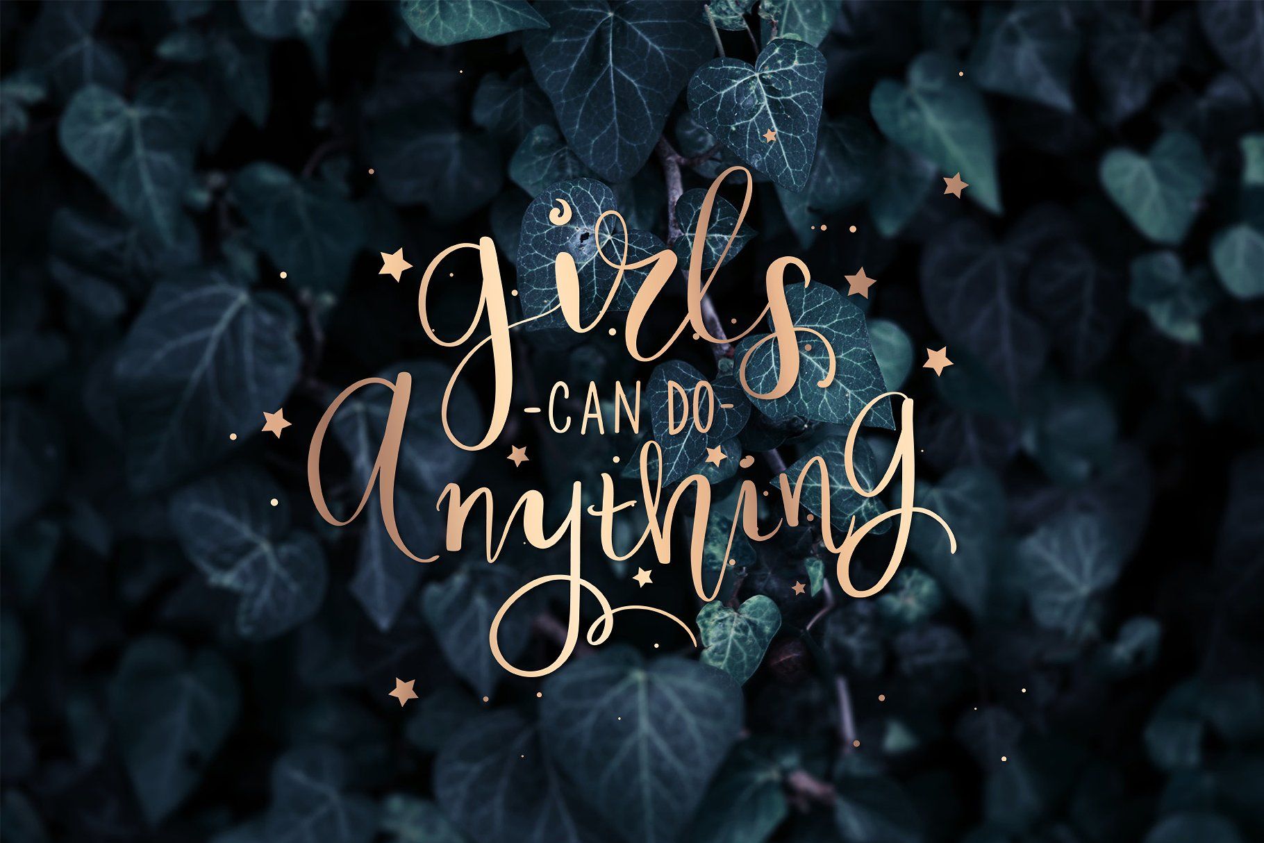 An inspirational quote wallpaper featuring the text 'Girls can do anything' in elegant gold script against a backdrop of lush green ivy leaves