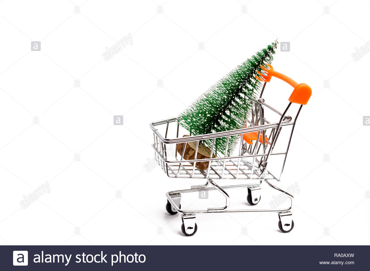 Christmas Tree In A Supermarket Trolley On An Isolated White