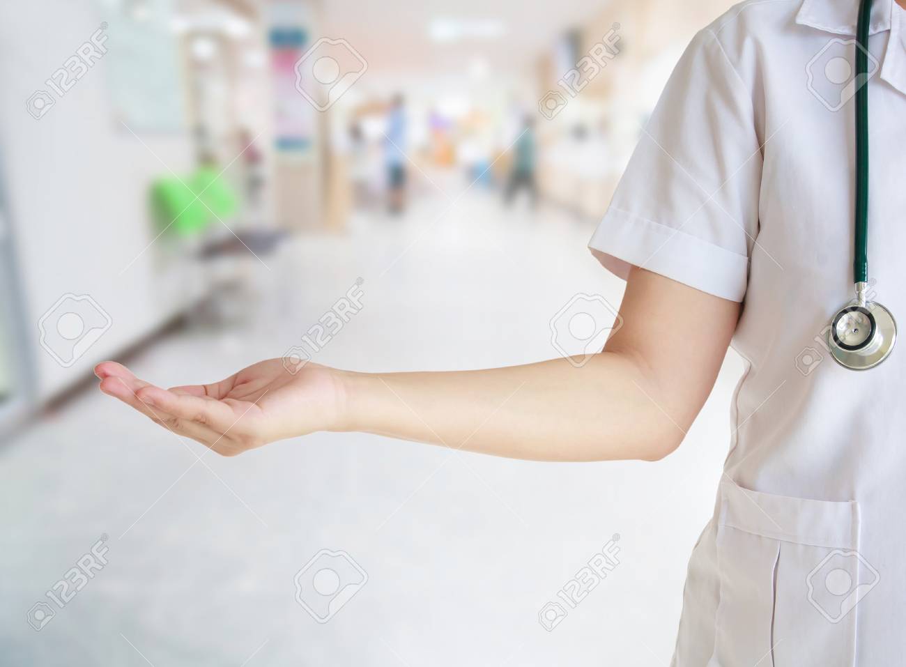 Doctor With Blur Hospital Background Stock Photo Picture And