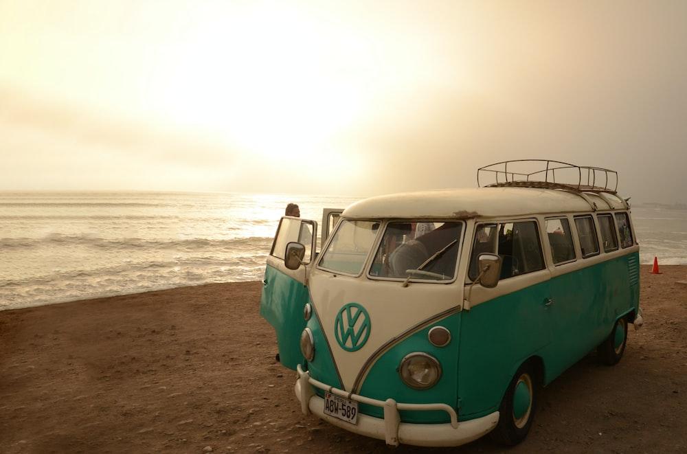 White And Blue Volkswagen T On Beach Shore During Daytime Photo