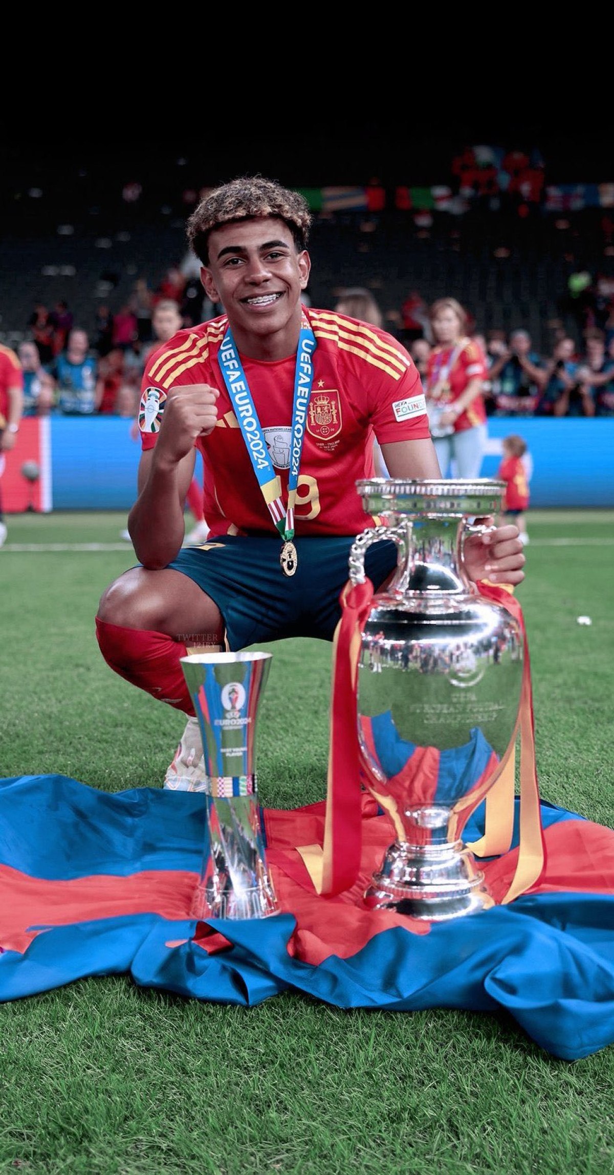 Lamine Yamal celebrates with the UEFA European Under-17 Championship trophy