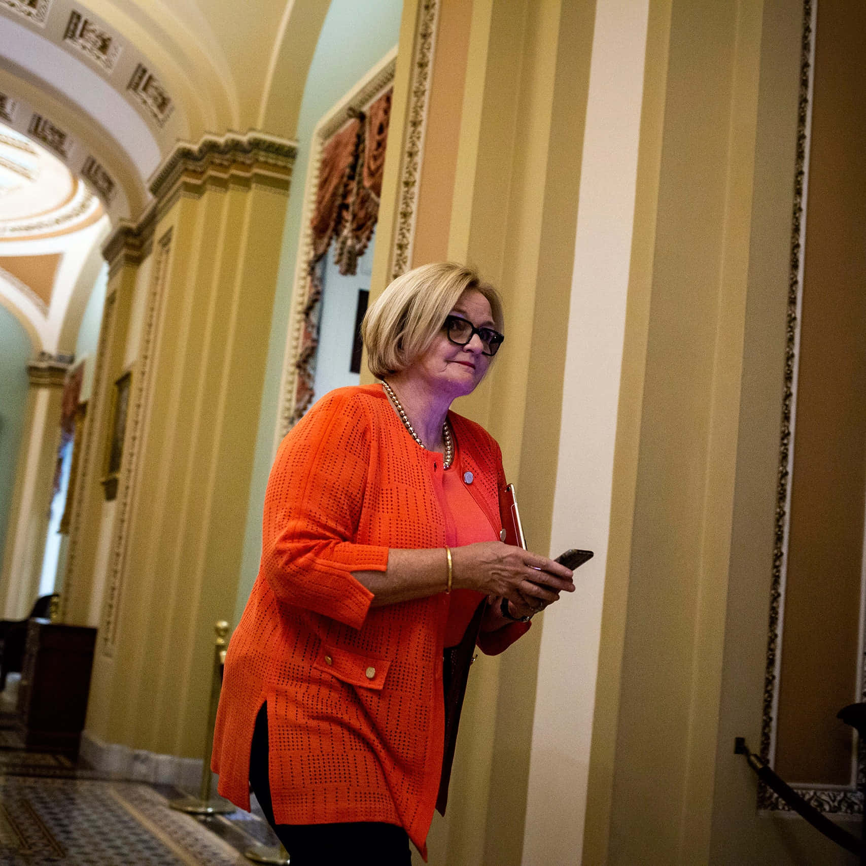 Claire Mccaskill Walking Through Capitol Hill Wallpaper