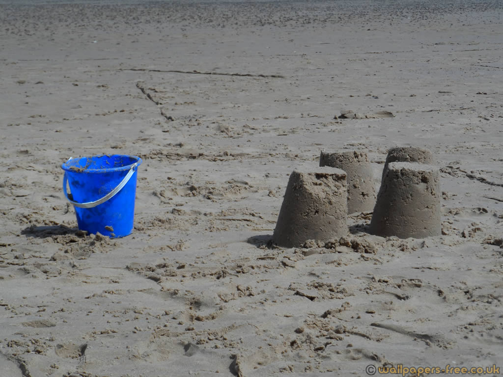 Sand Castles And Bucket   nature wallpaper featuring beaches and