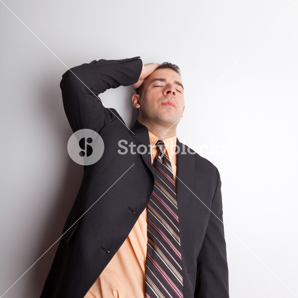 Stressed Out Business Man Isolated Over A Silver Background