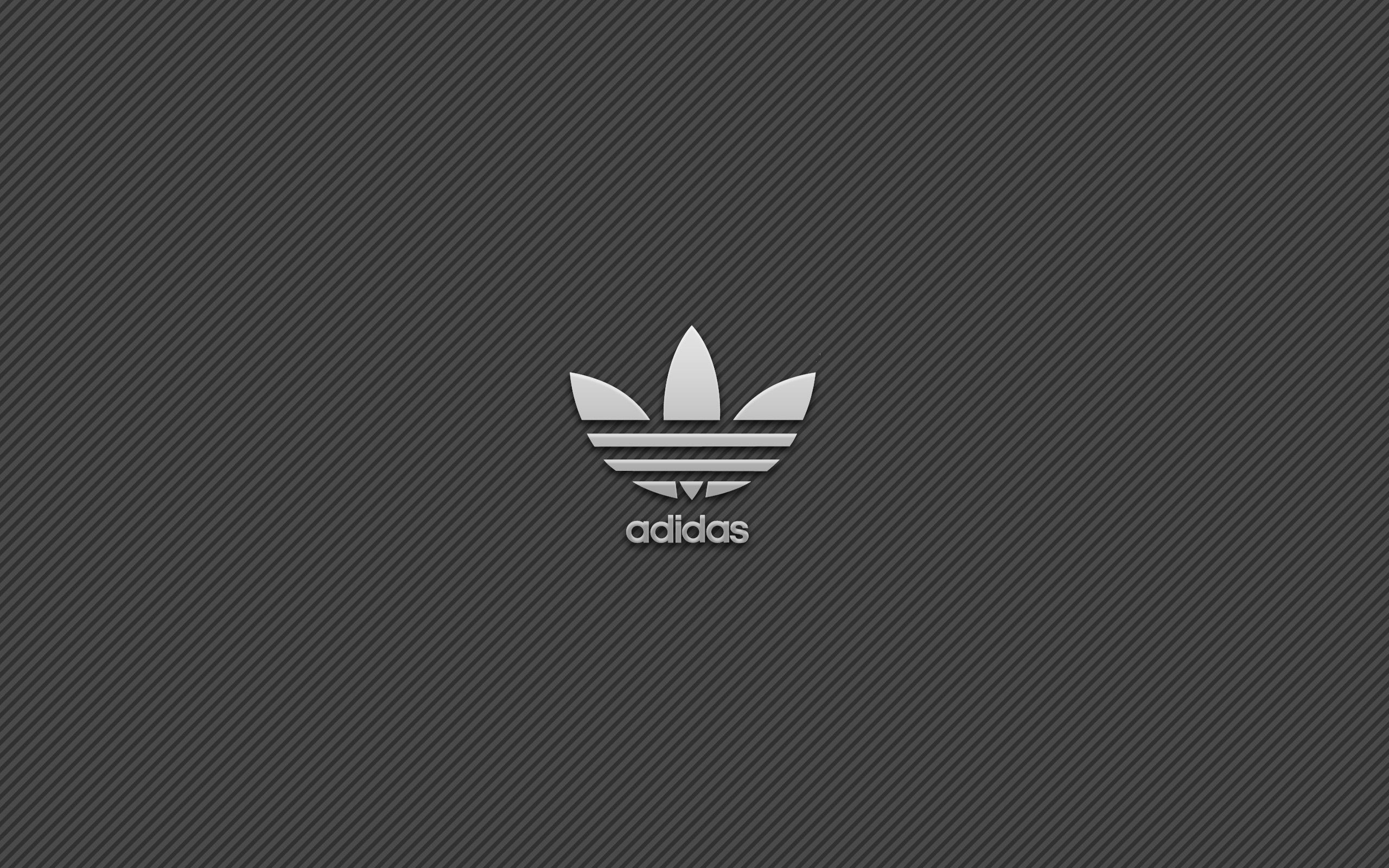 Sleek Adidas logo on a dark gray textured background