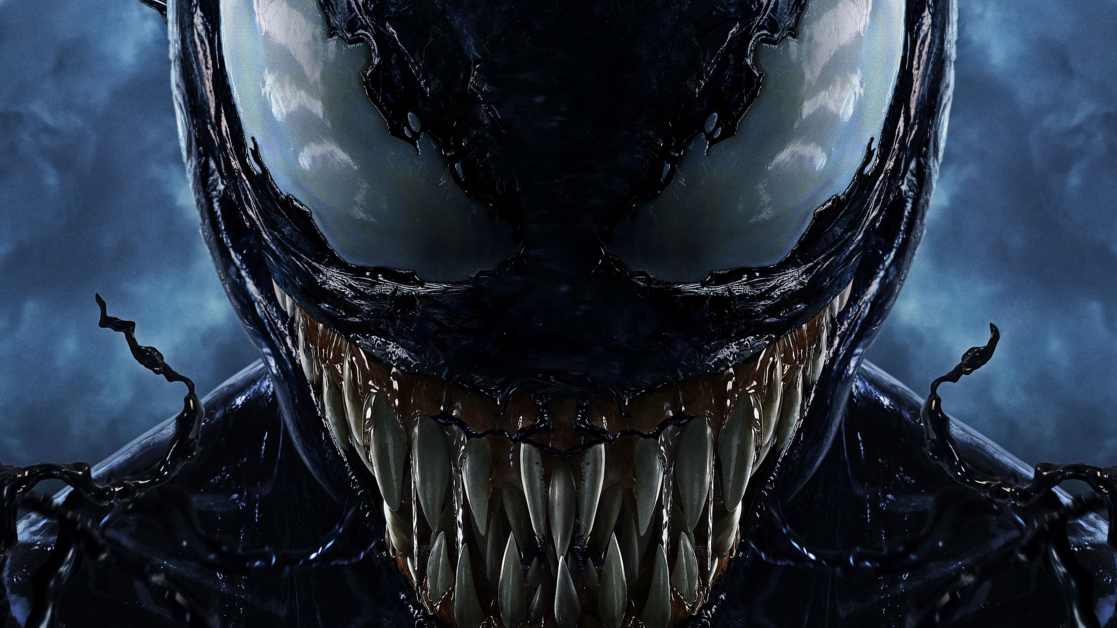 Close-up of Venom's menacing face, showcasing sharp teeth and intense eyes