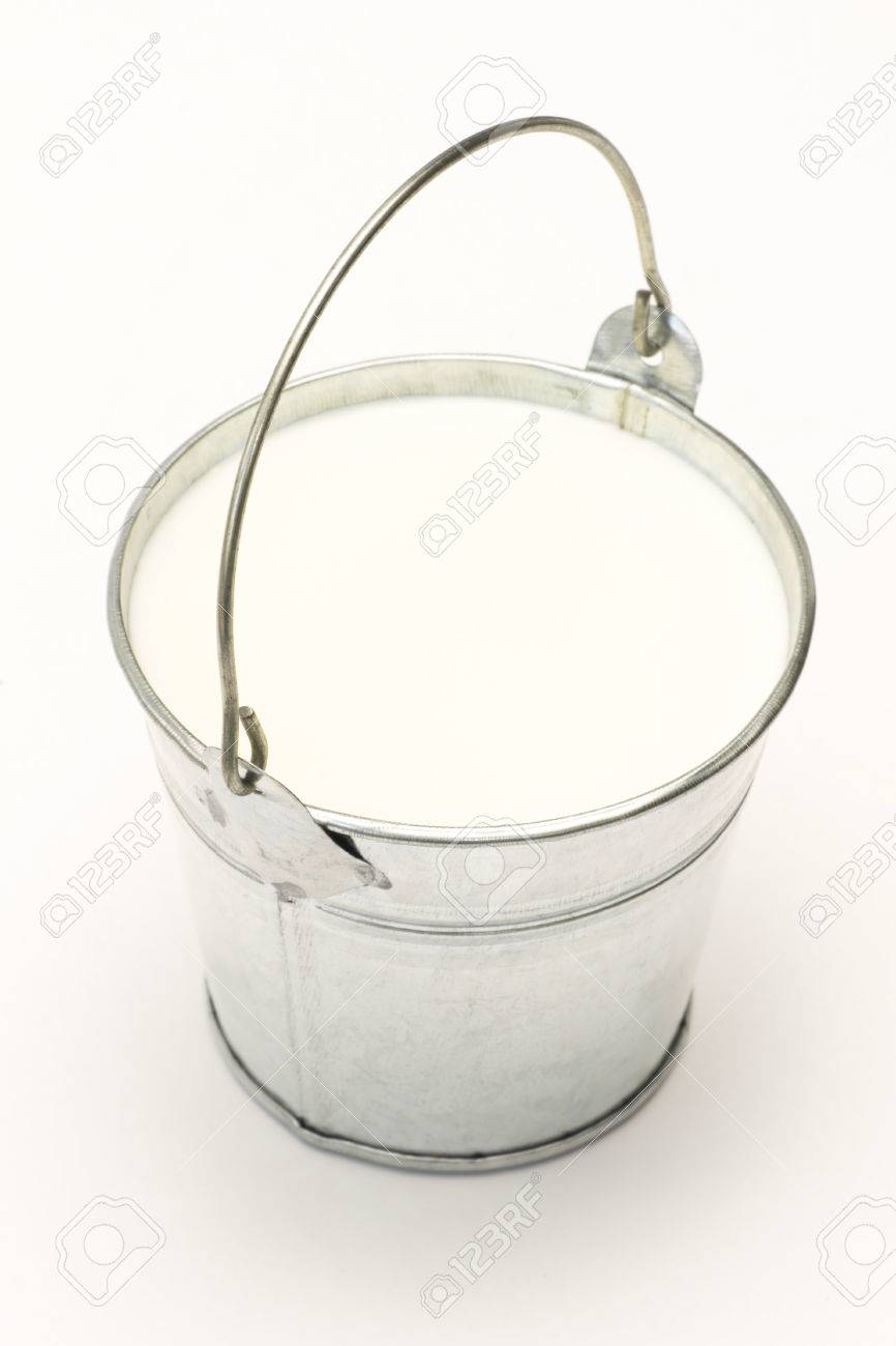 Metal Pail Bucket Full Of Milk On A White Background Stock Photo