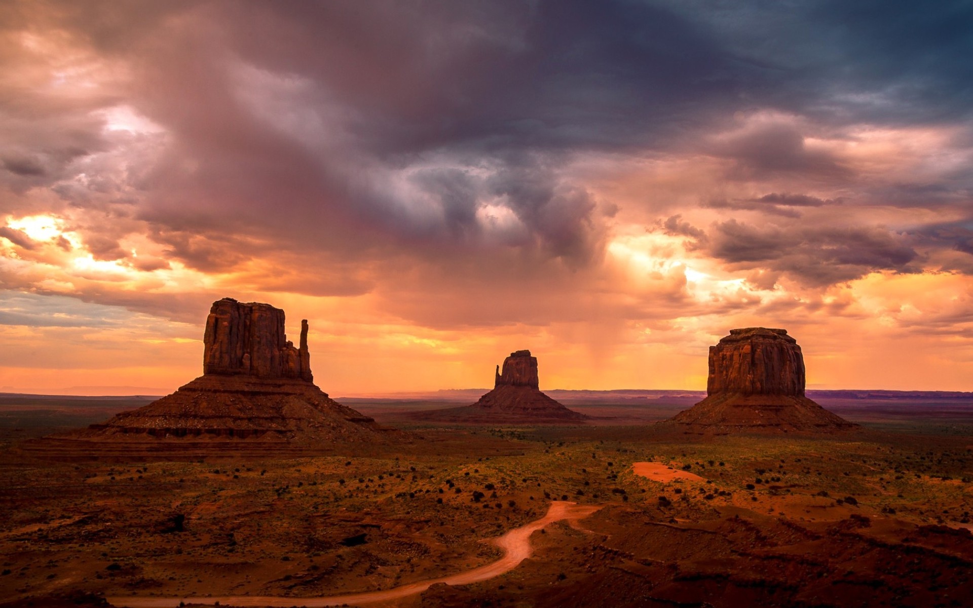 Majestic Sunset Over Monument Valley Wallpaper