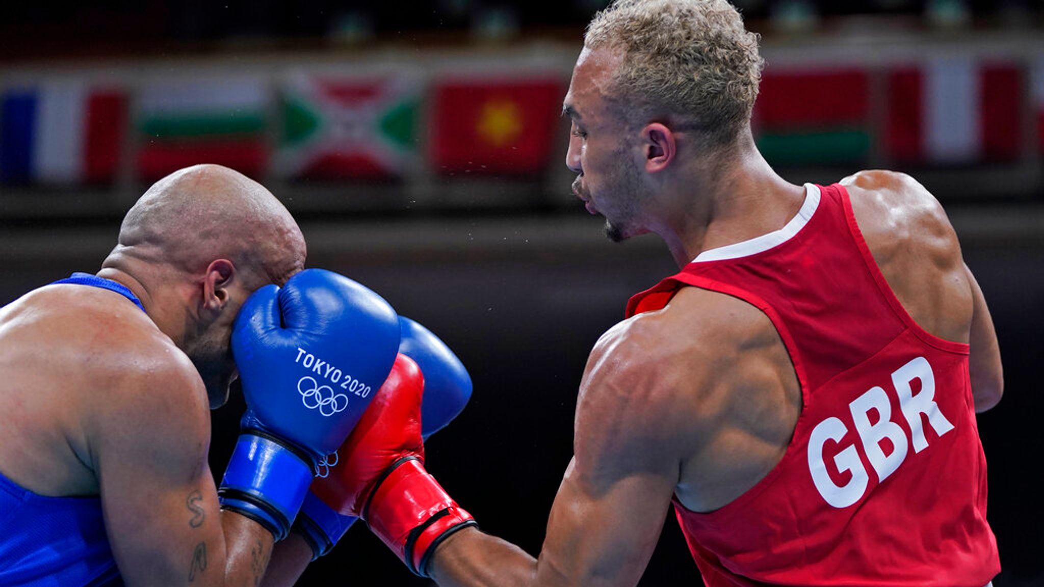 Benjamin Whittaker lands a punch on his opponent during a boxing match