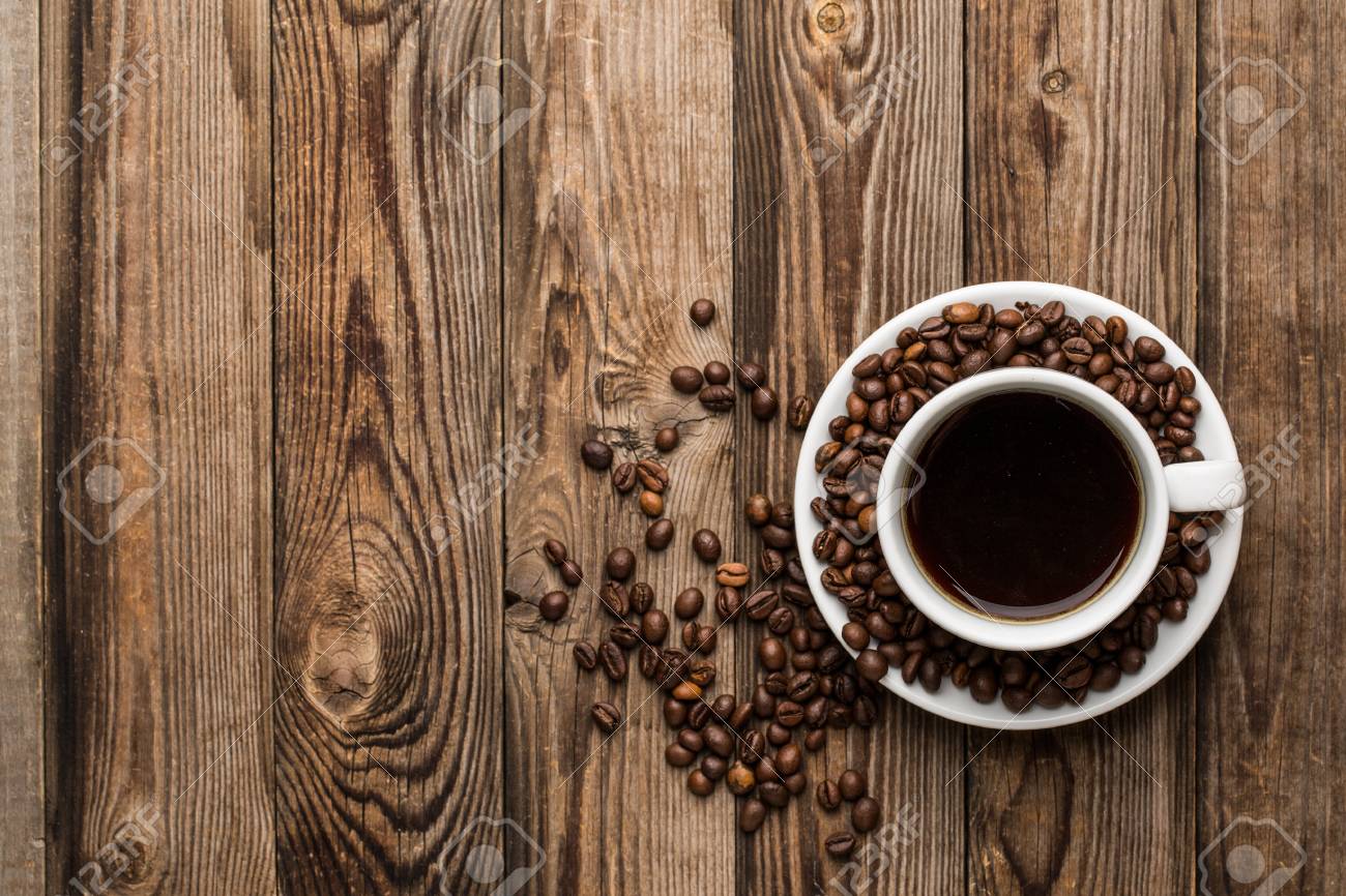 Coffee Cup And Beans On Wooden Background Top Stock