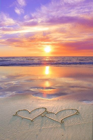  beach sunset with hearts drawn in the sand Happy Valentines Day