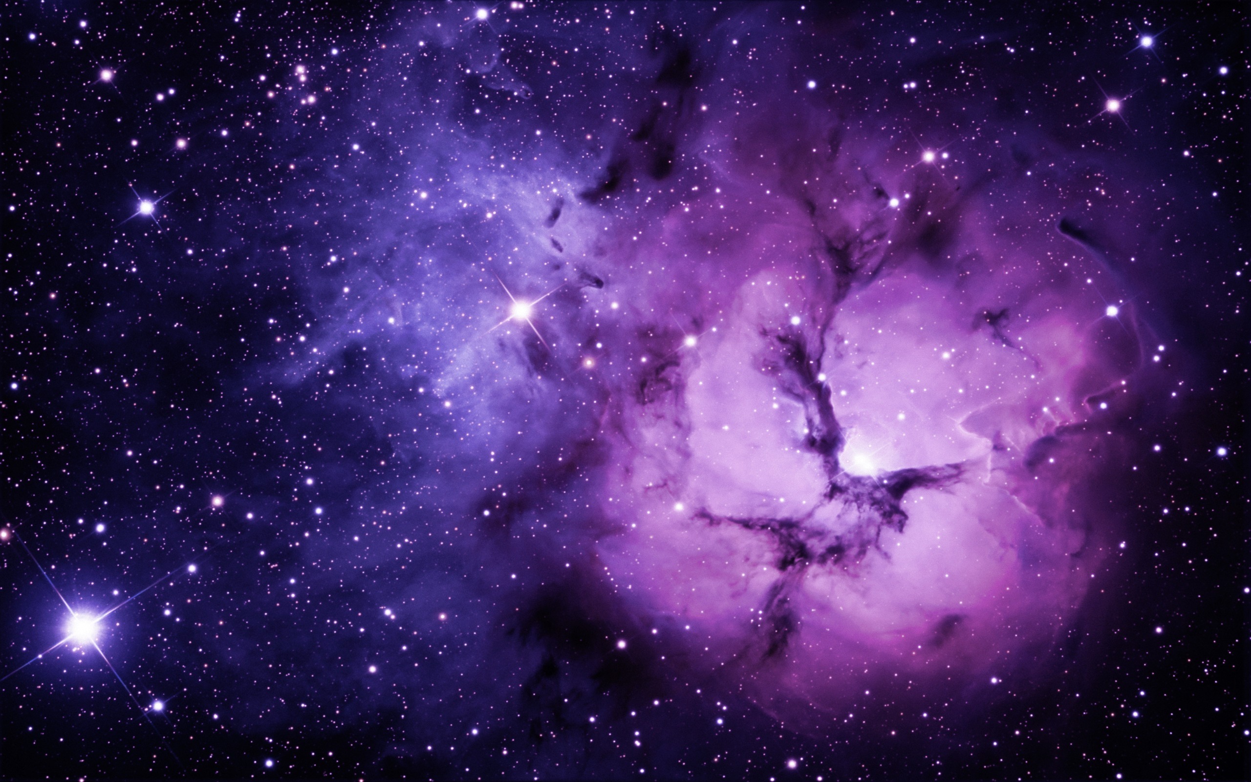 A breathtaking purple nebula in the vast expanse of outer space, surrounded by countless stars