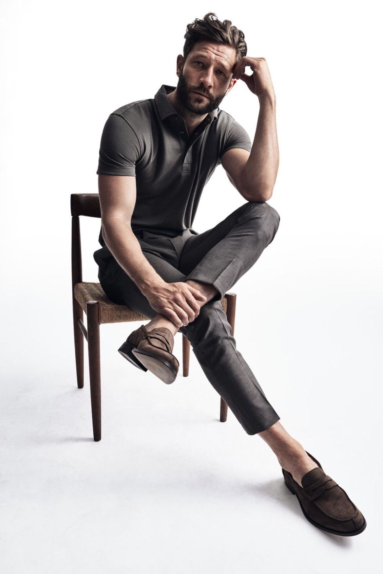 The Top Male Model Poses For A Photoshoot Standing Wallpaper