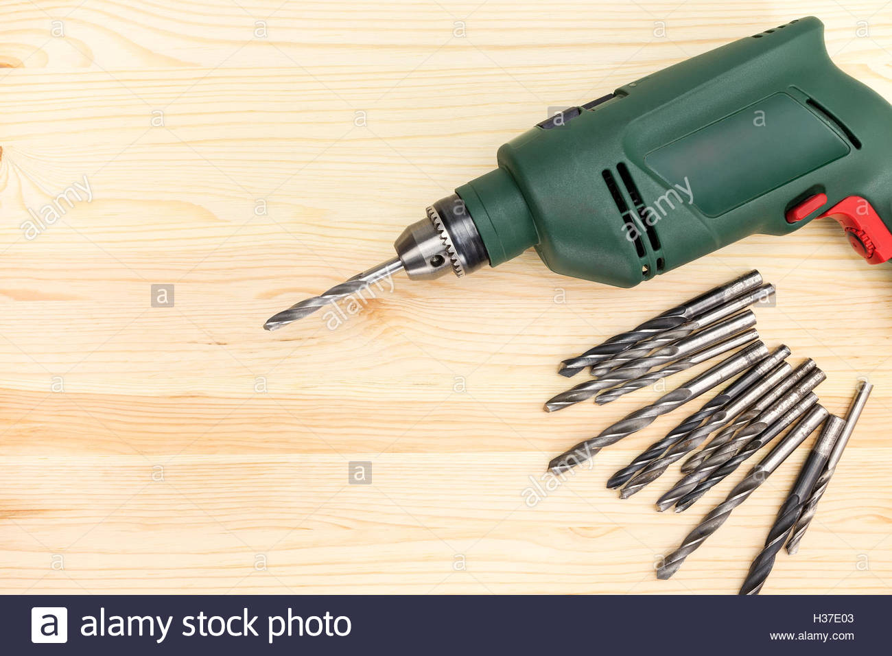 Portable Hand Electric Drill On Wooden Background Stock Photo