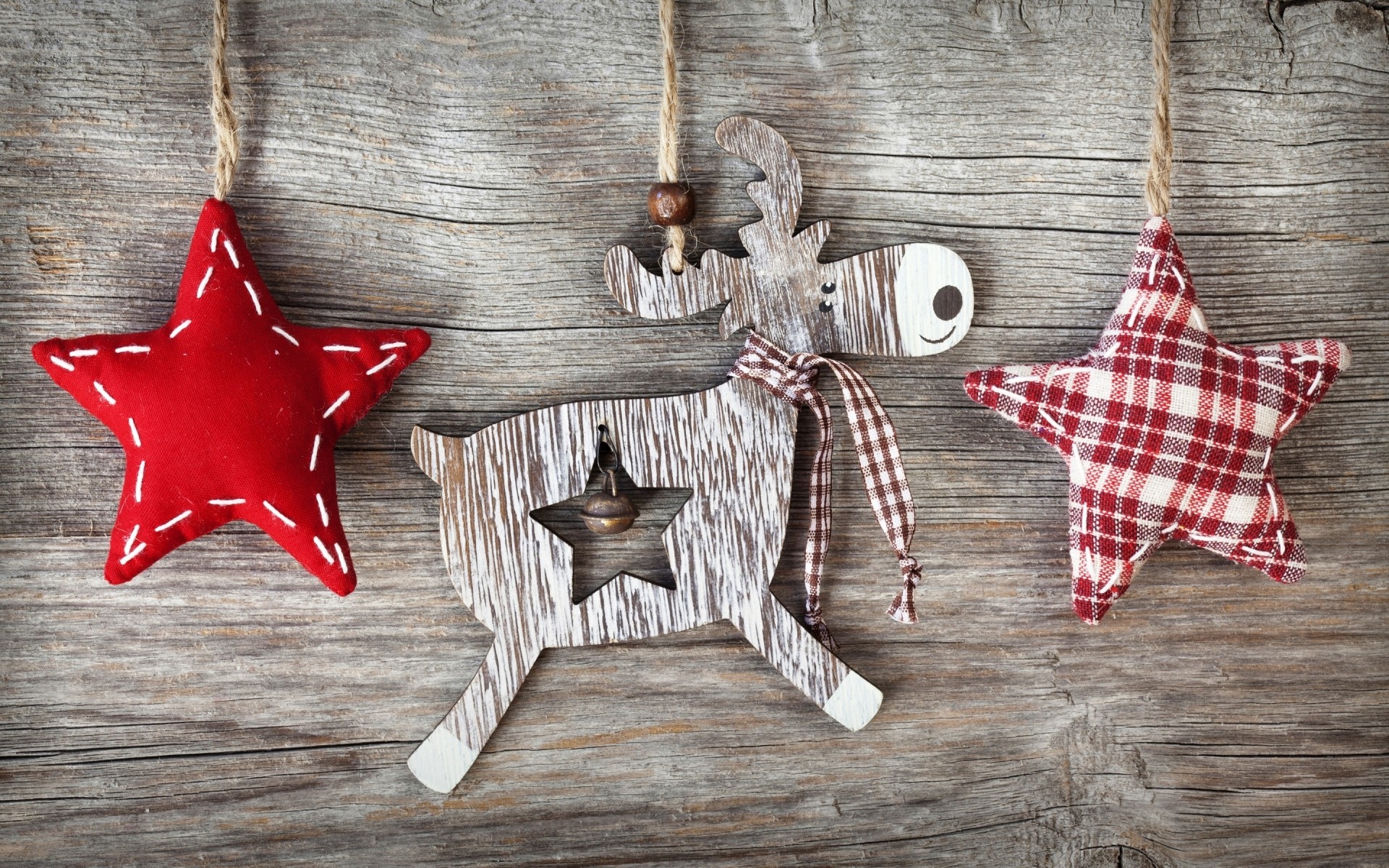 A Wooden Deer With Bow And Pair Of Christmas Stars Sewn From