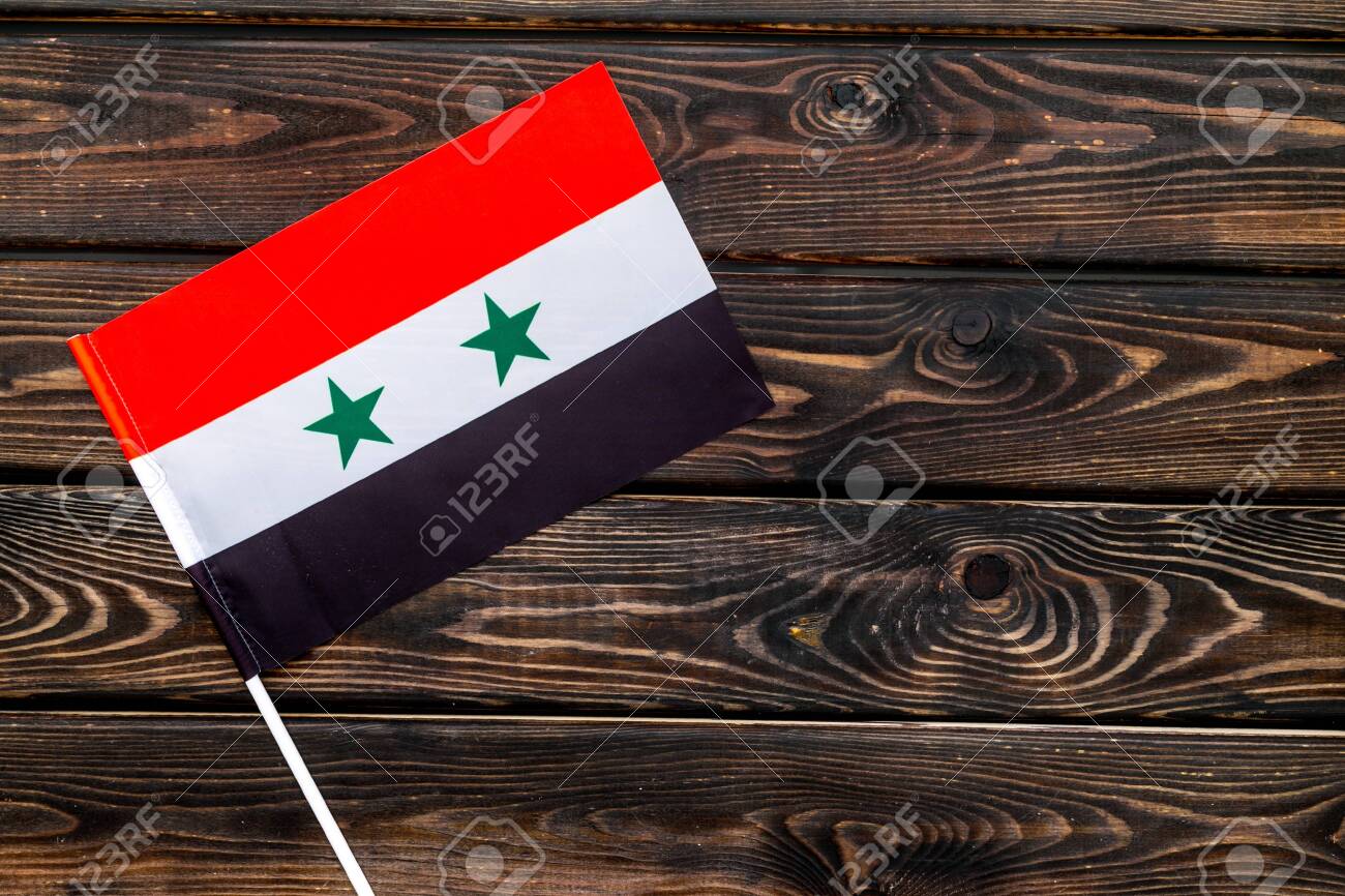 Independence Day Of Syria Concept With Flag On Wooden Background