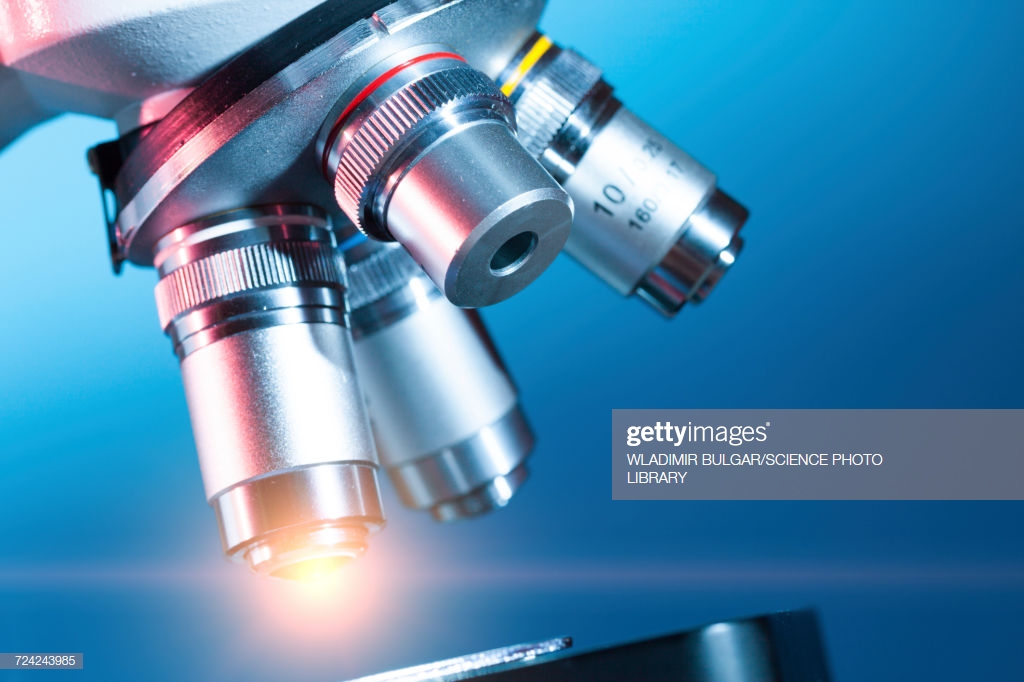 Microscope Against Blue Background High Res Stock Photo Getty Image