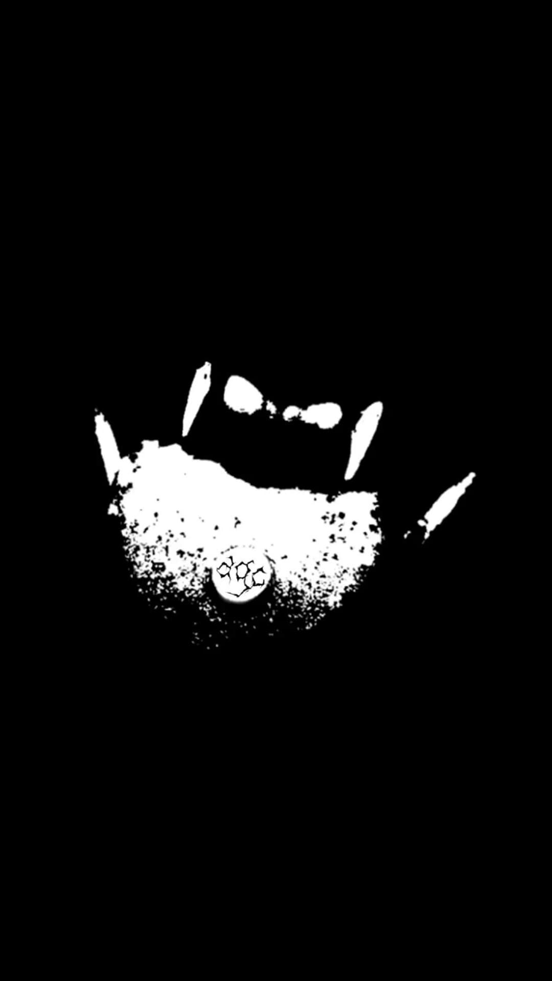 Black and white abstract image resembling a handprint with a small, textured circle in the palm