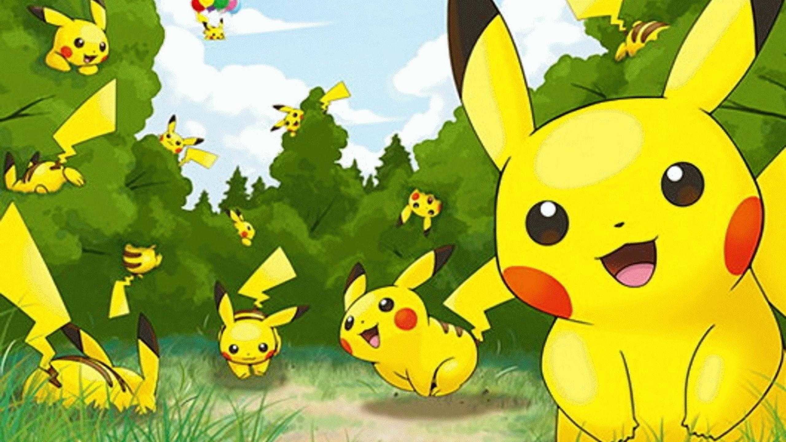 A group of adorable Pikachu in a grassy field and trees, with one larger Pikachu in the foreground