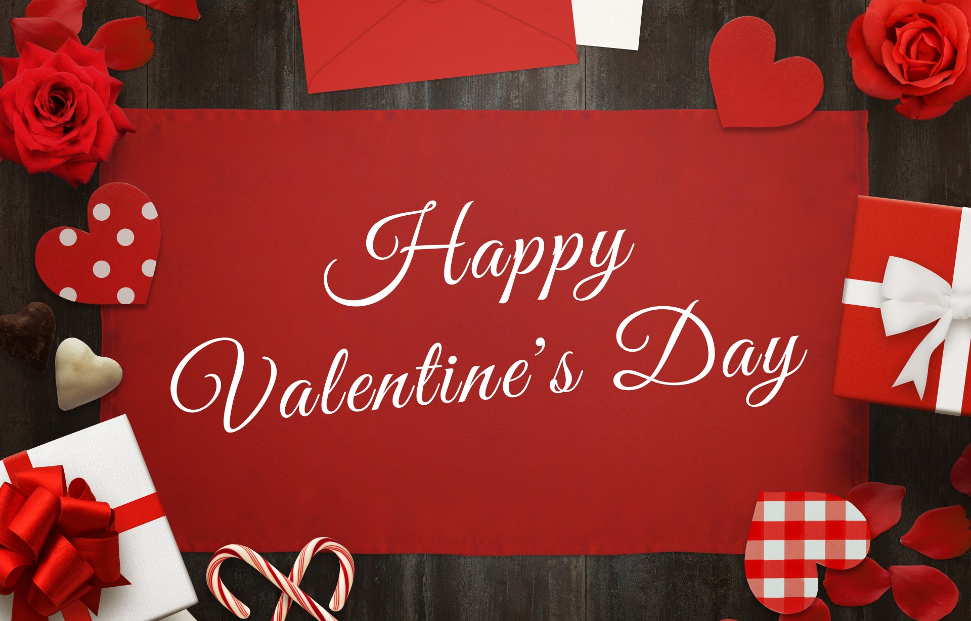 A festive Valentine's Day image with a red background, gifts, hearts, roses, chocolates, and the text 'Happy Valentine's Day'