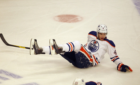 Taylor Hall Of The Edmonton Oilers Slides Across