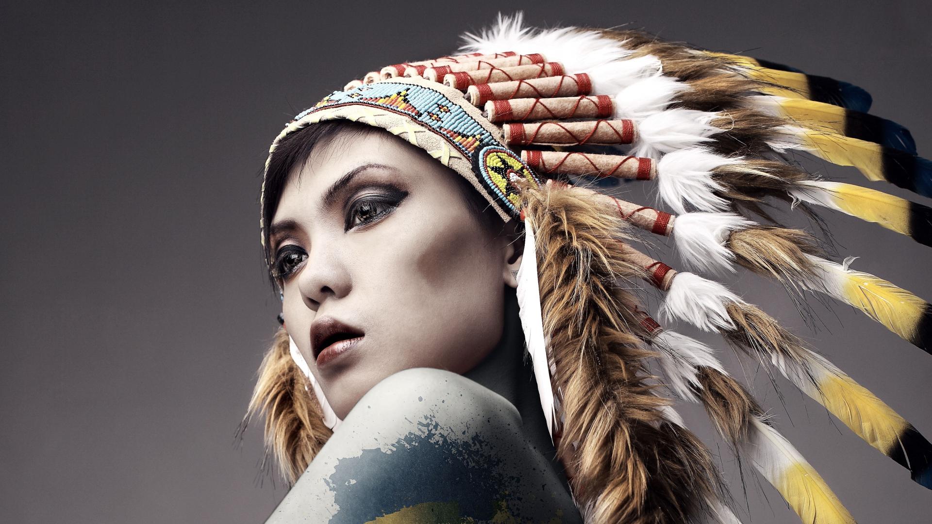 Women artistic fashion feathers head dress body painting