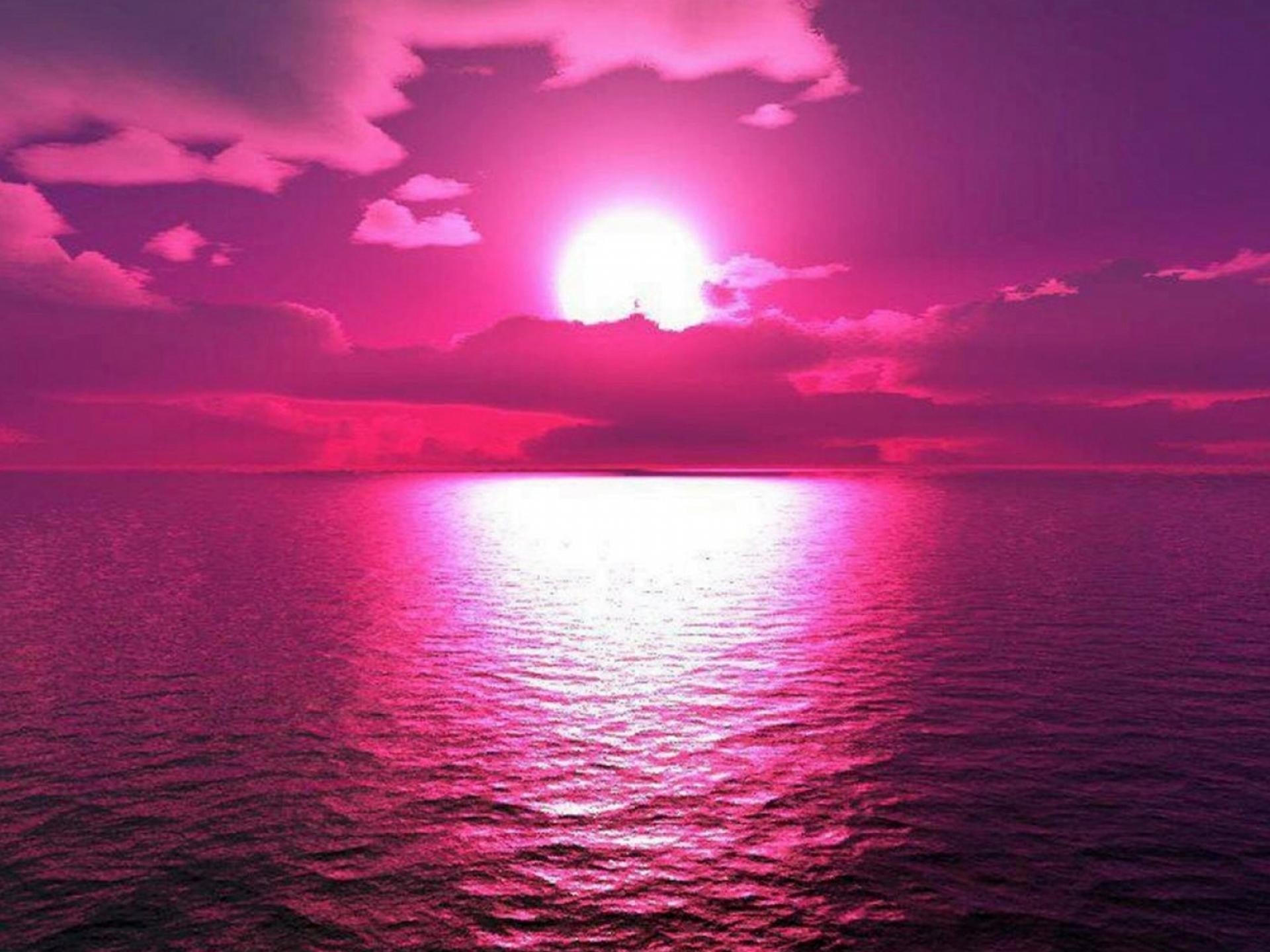 Vivid Pink Sunset over Calm Ocean