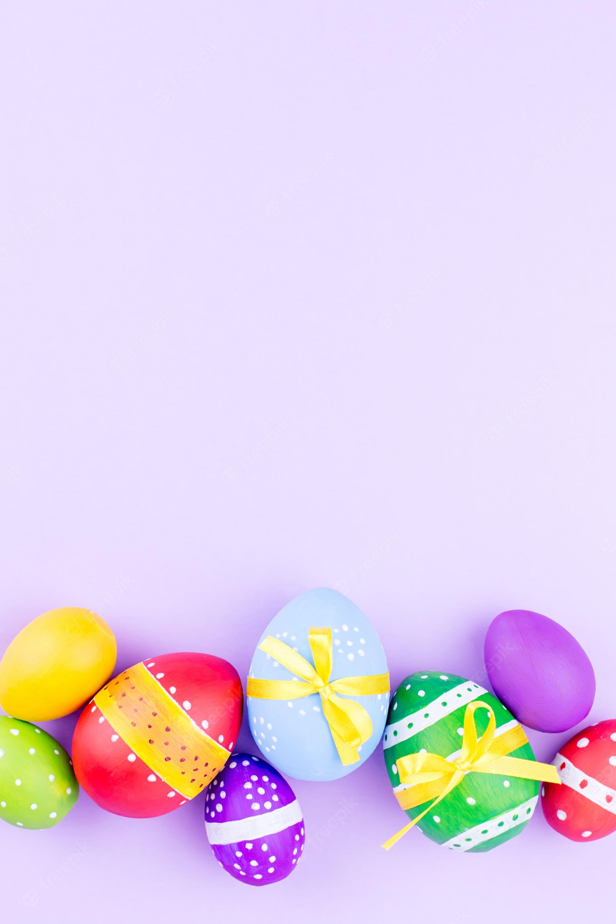 Premium Photo Colorful Easter Eggs On Pastel Purple Background