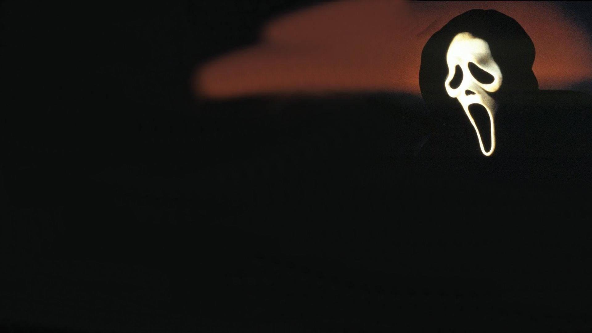 Caption Ghostface From The Scream Franchise Wallpaper
