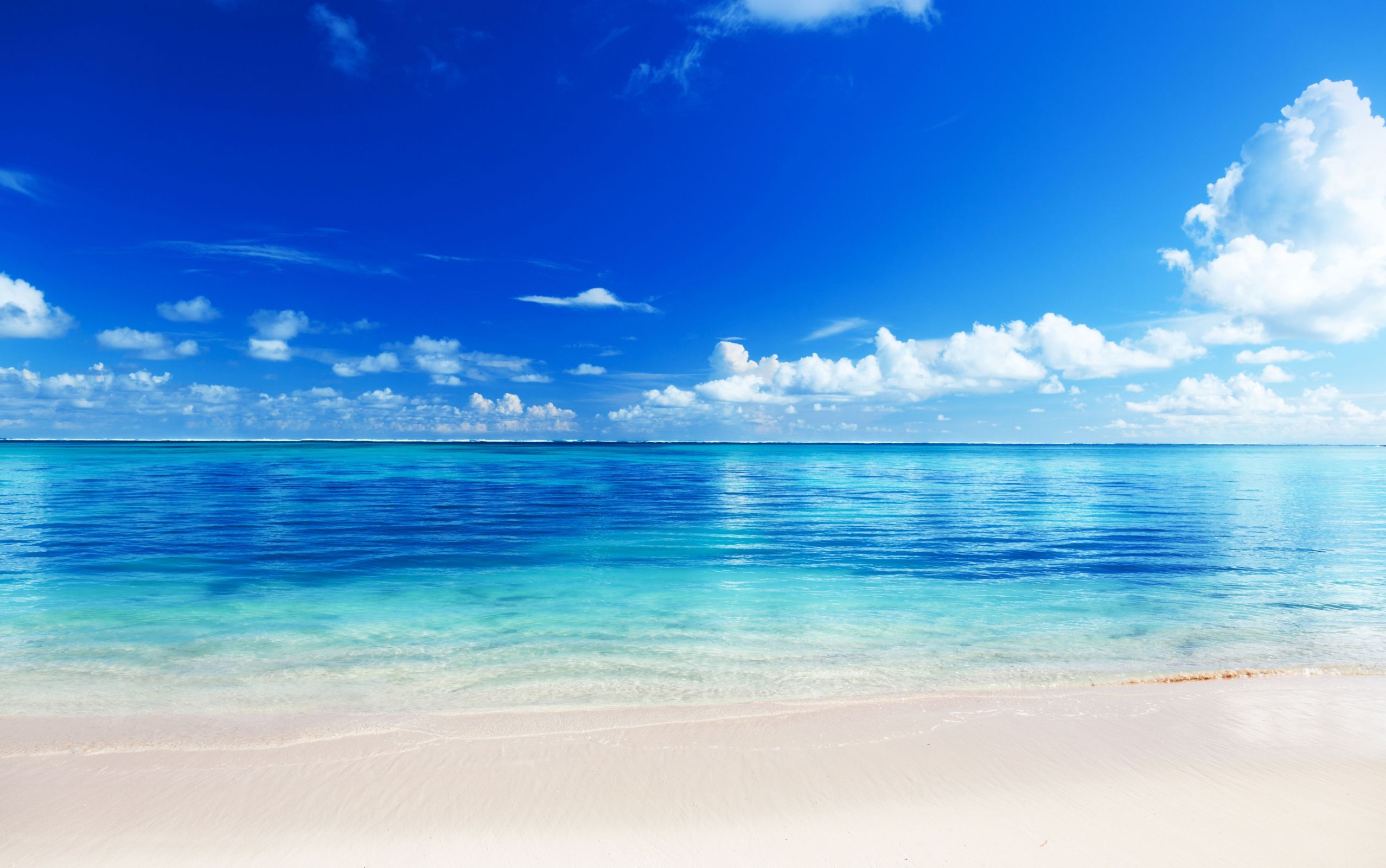 Beach sand ocean horizon sky clouds blue wallpaper