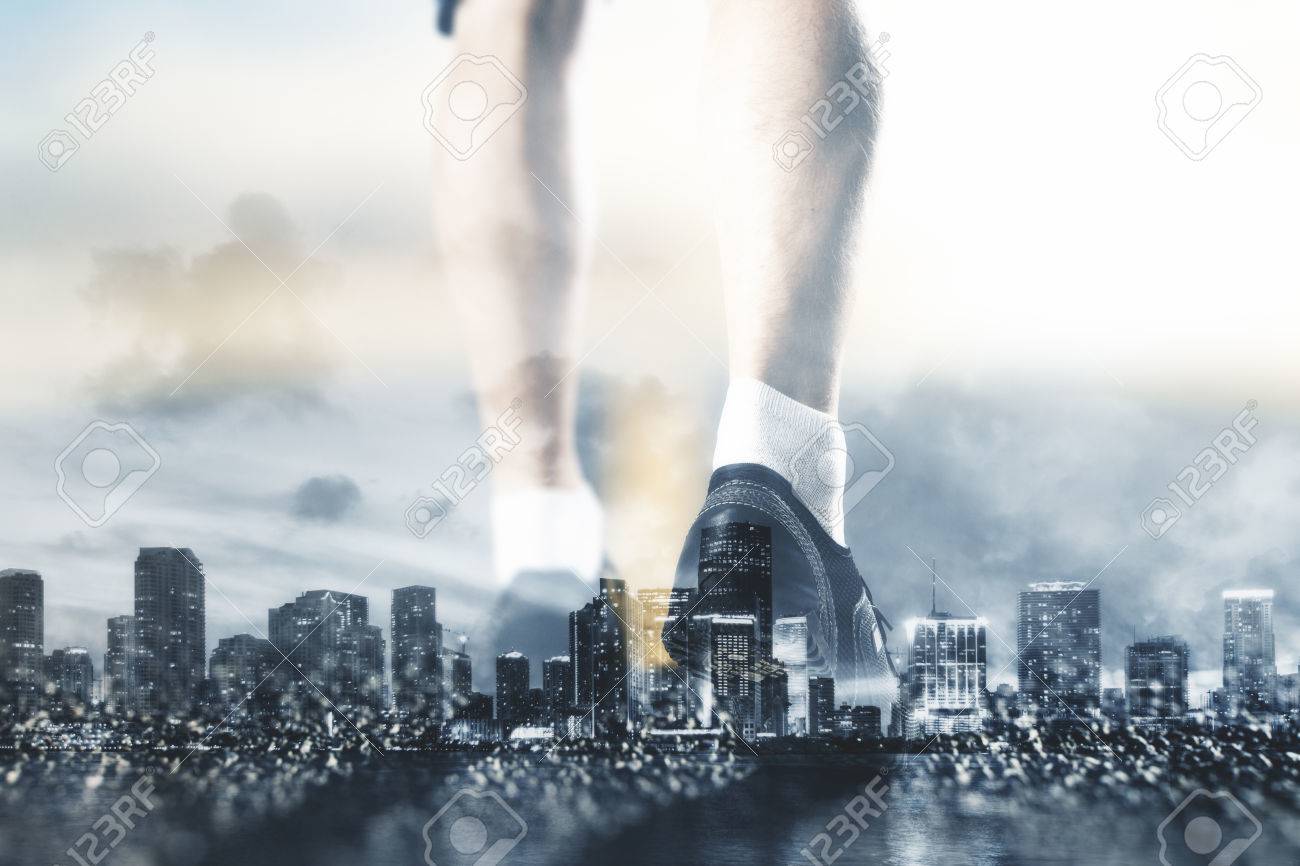 Back Of Jogging Man Feet On City Background Fitness Concept
