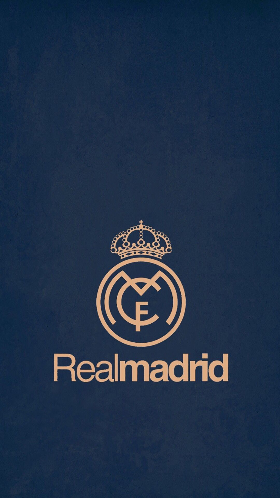 A minimalist dark blue wallpaper featuring the classic Real Madrid CF logo in a subtle gold color
