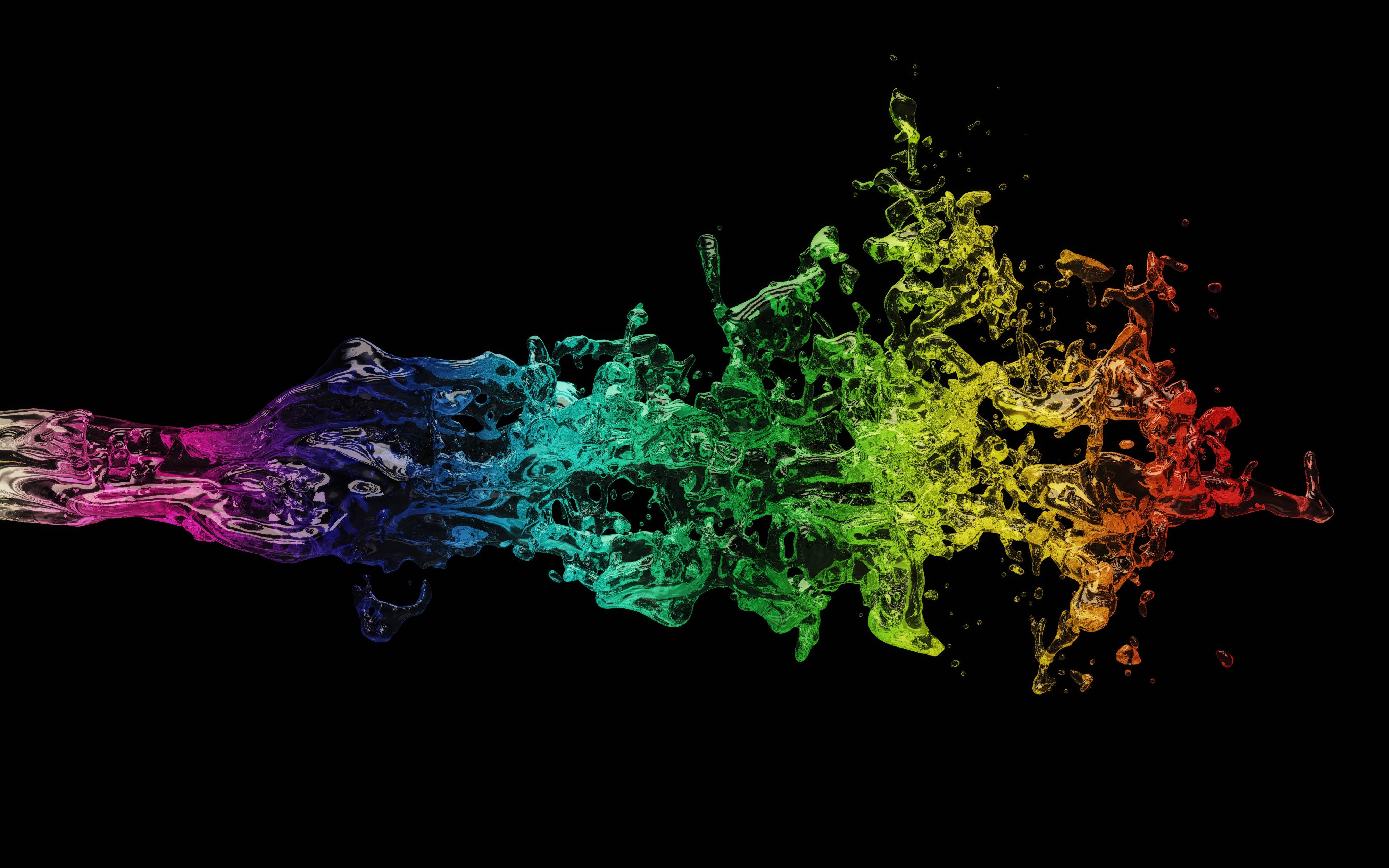 A vibrant splash of rainbow-colored liquid against a black background, creating a dynamic and colorful abstract AMOLED wallpaper