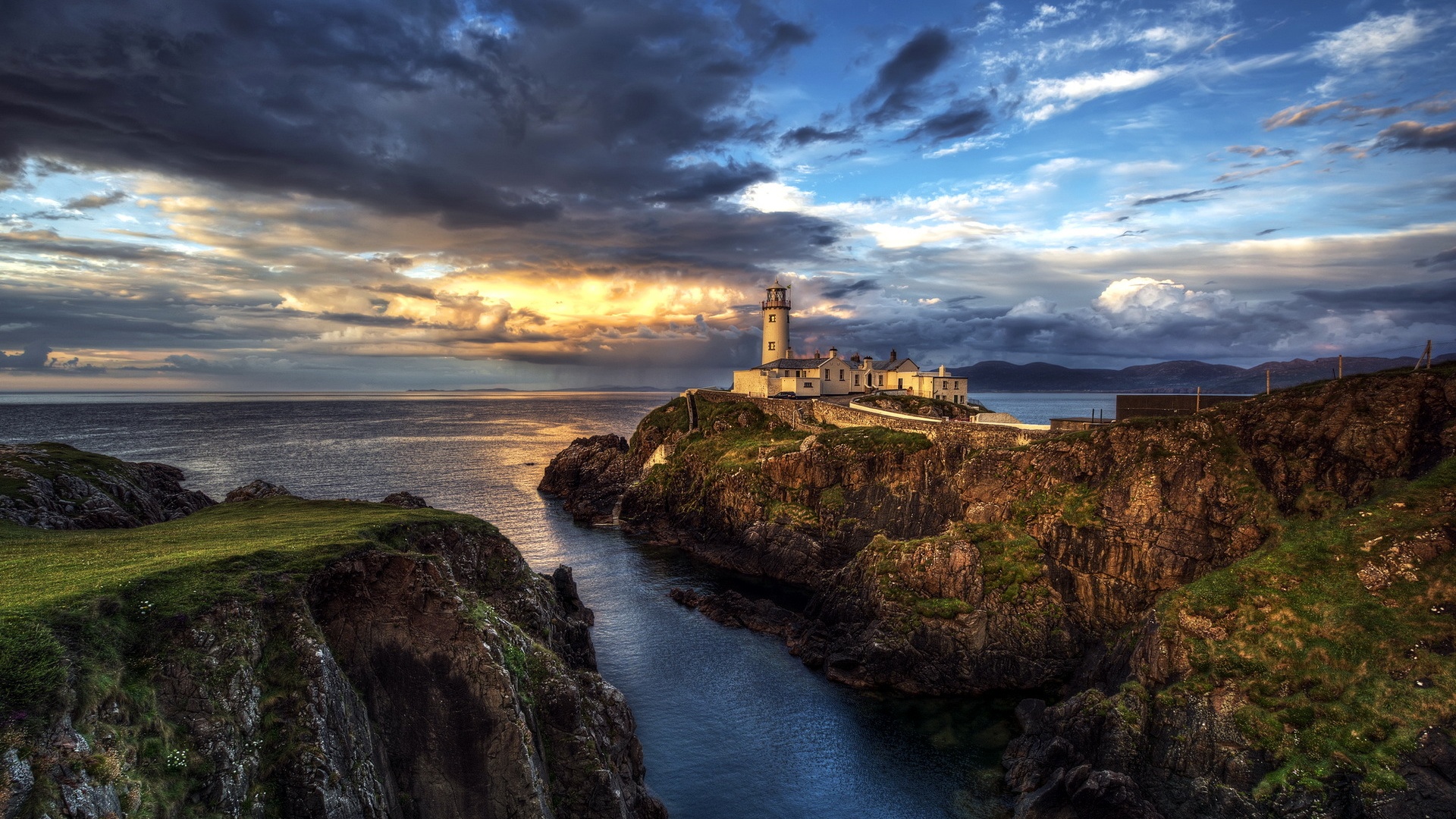 Ireland lighthouse ocean seascape sunset clouds Wallpaper Widescreen
