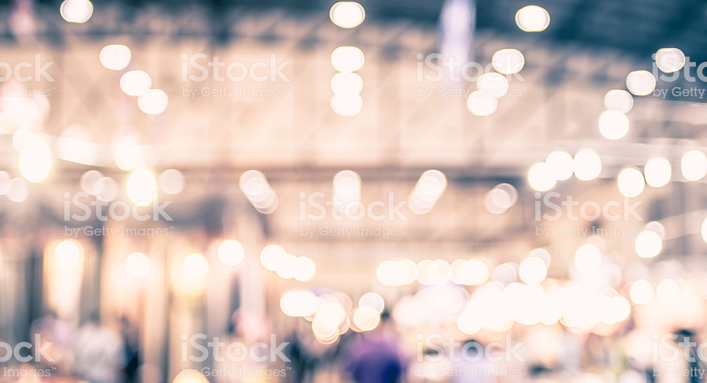 Blurred Background Crowd Of People In Expo Fair With Bokeh Stock