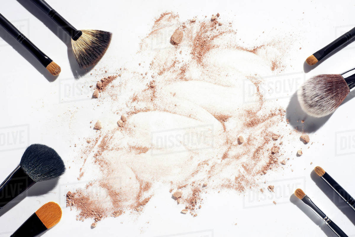 Frame Of Make Up Brushes On White Background With Scattered Face