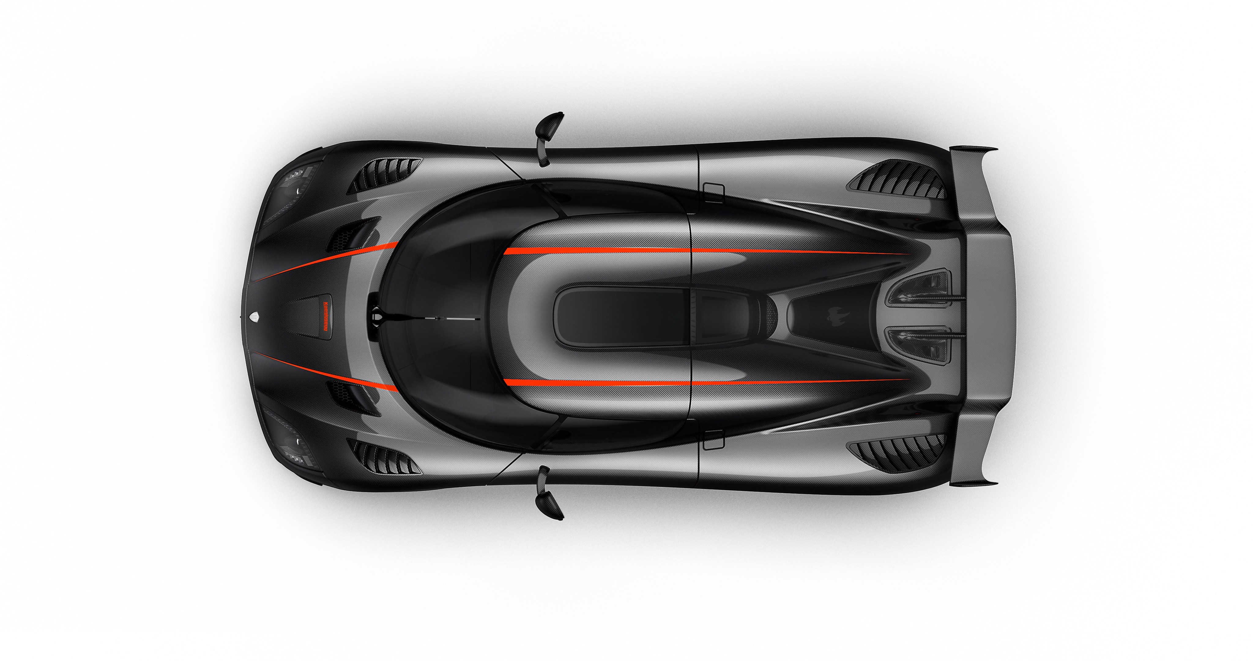 Top view of a black Koenigsegg Regera with orange accents, showcasing its aerodynamic design and carbon fiber details