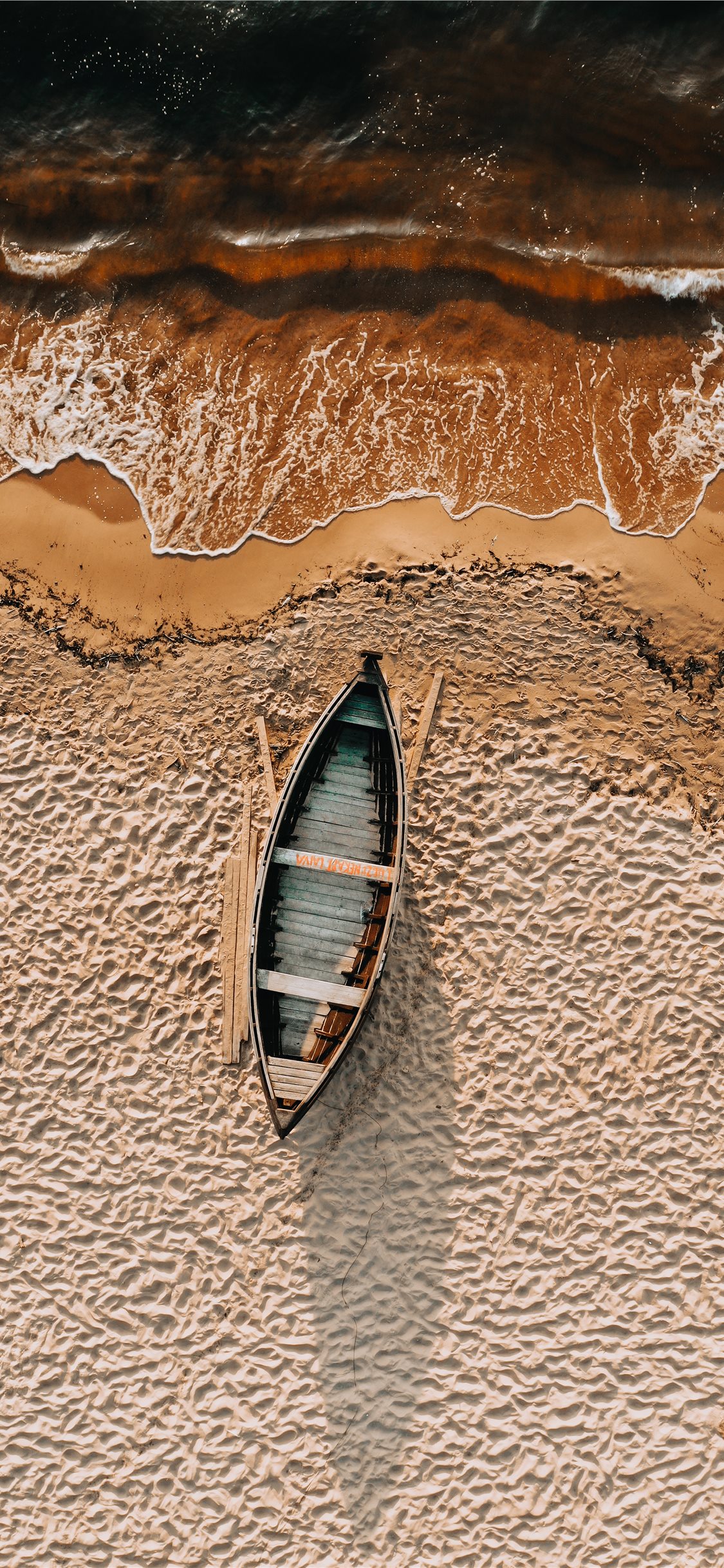 brown and white boat on brown sand iPhone Wallpapers Download 1125x2436