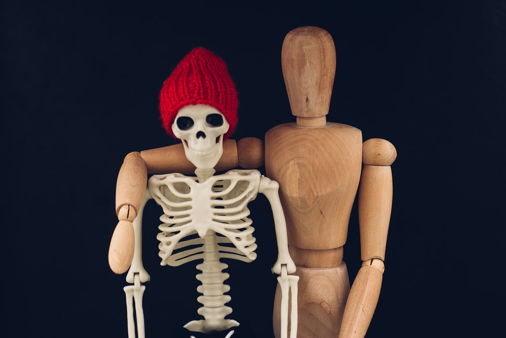 Skeleton With Red Knit Cap And White Gloves Photo Black