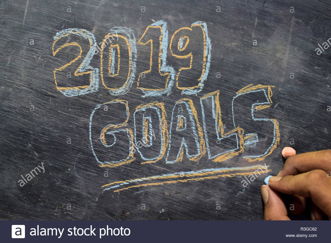 Goals Handwritten Text With Colorful Chalk On Blackboard