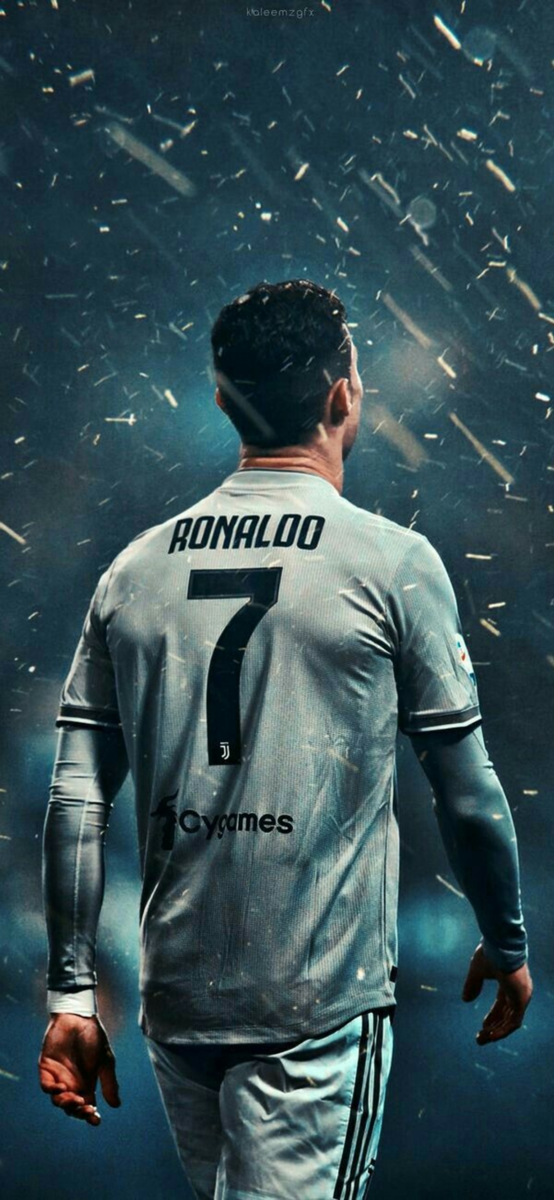 Cristiano Ronaldo walking away from camera view wearing a Juventus jersey with the number 7 on his back, amidst a shower of particles under dimmed lights