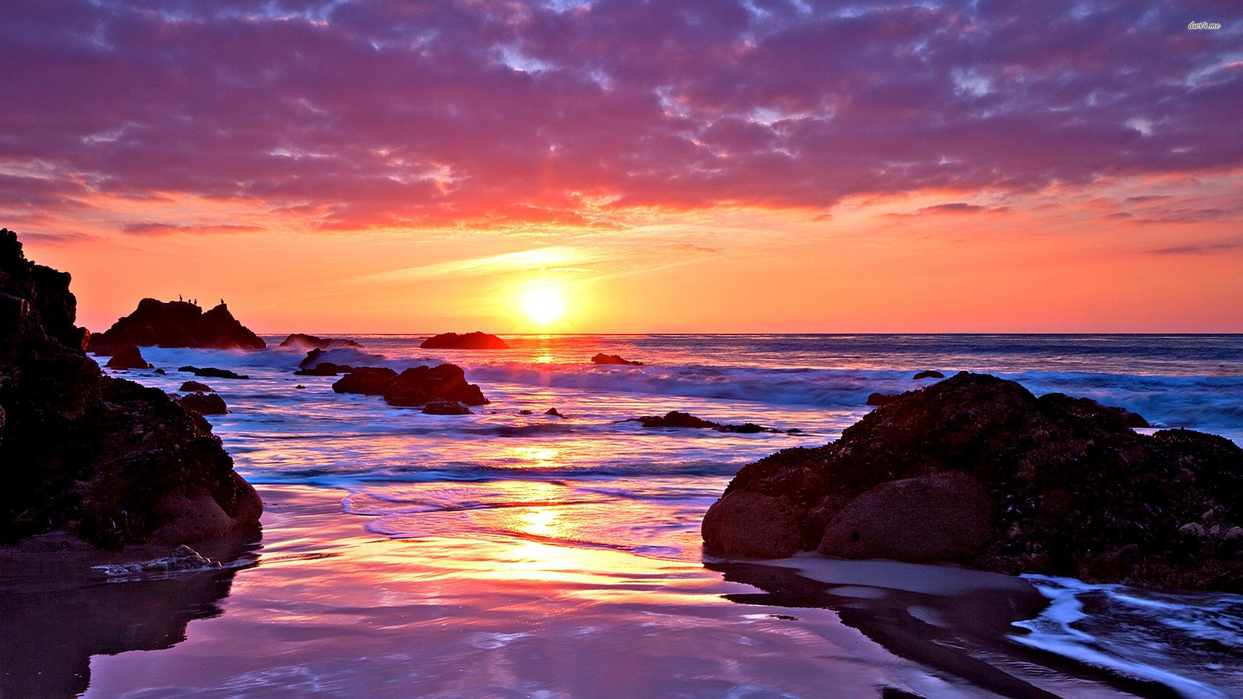 Vivid Sunset over a Rocky Beach