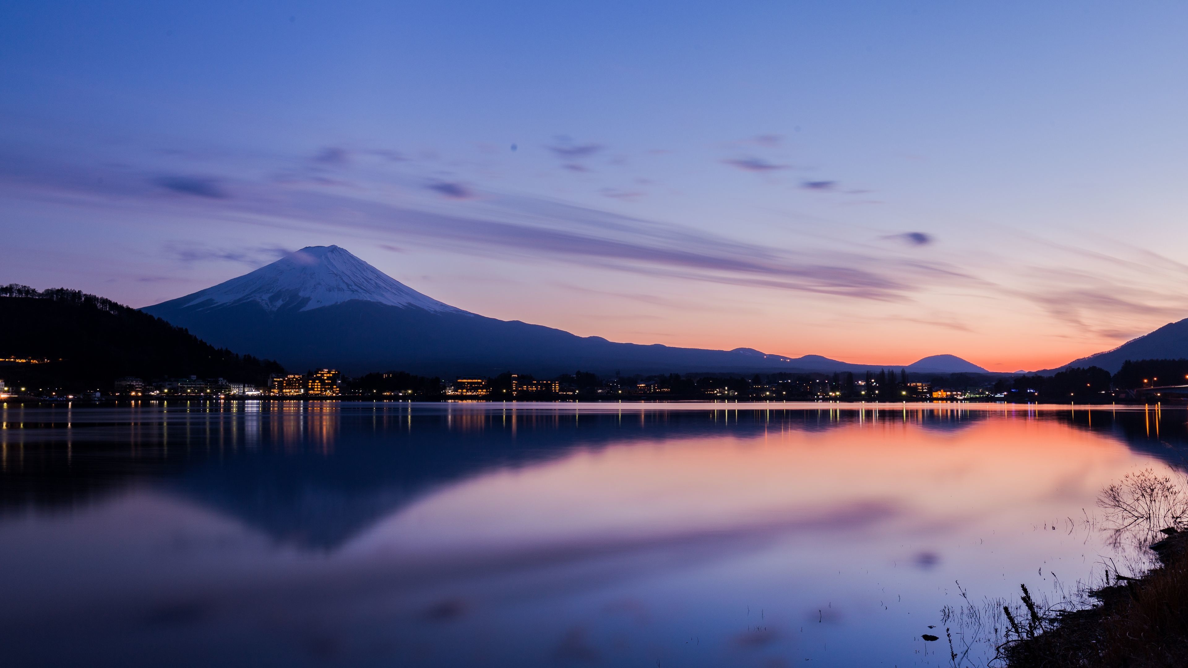 Mount Fuji reflected in Lake Kawaguchiko at sunset in 4K resolution, Tokyo, Japan