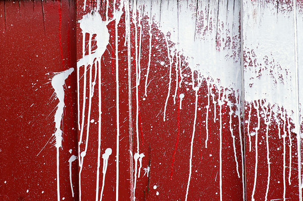 Splatter White Paint Splattered On A Red Warehouse Door