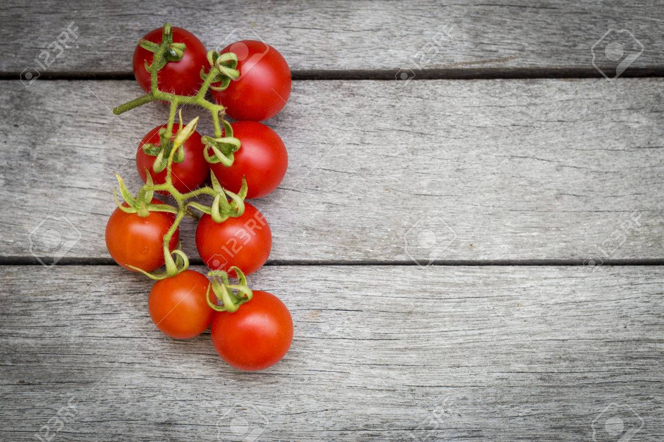 Fresh Cherry Tomato On Vintage Background Stock Photo Picture And