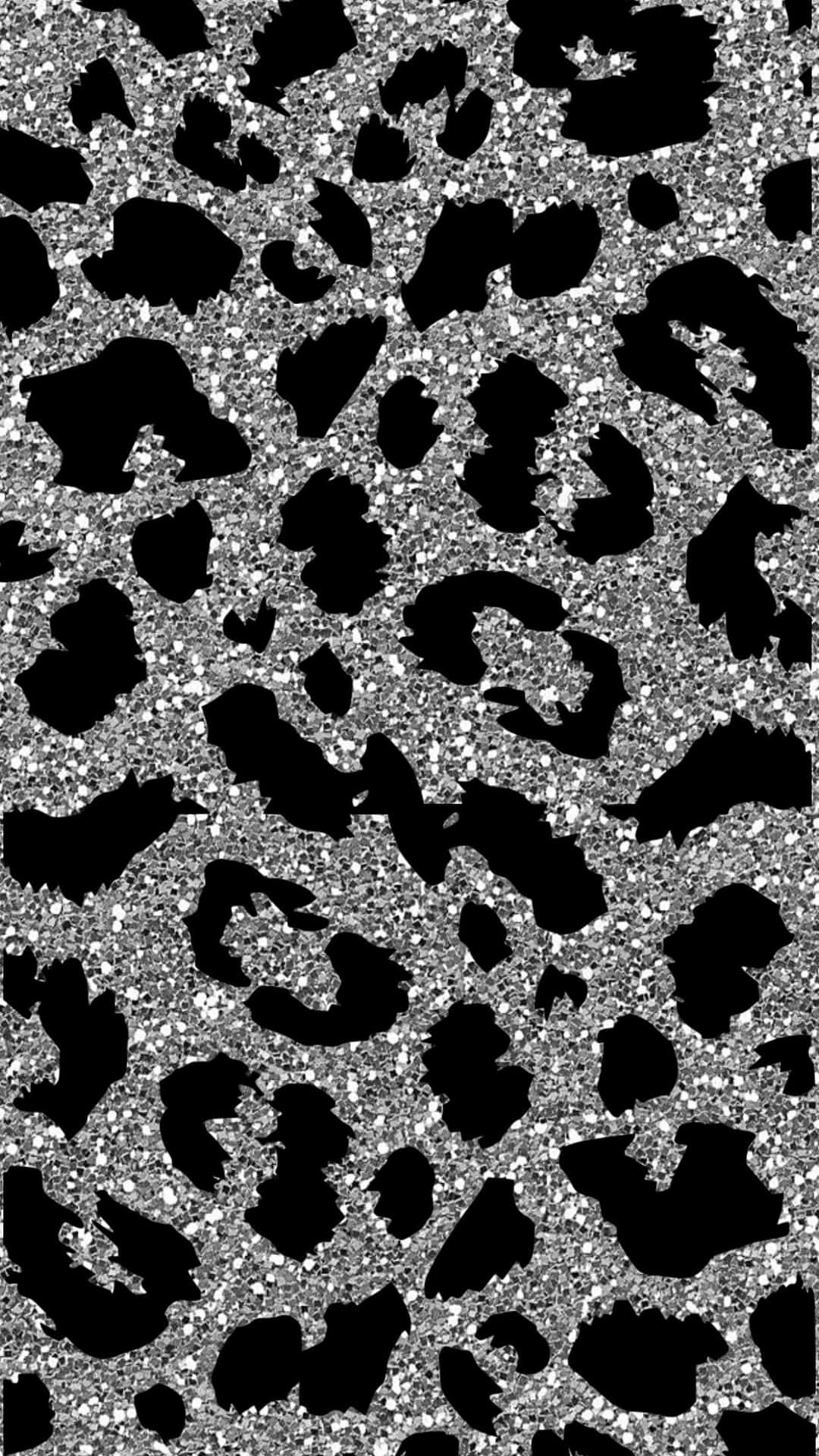 A captivating close-up of a glitter leopard wallpaper, showcasing a striking black and silver design