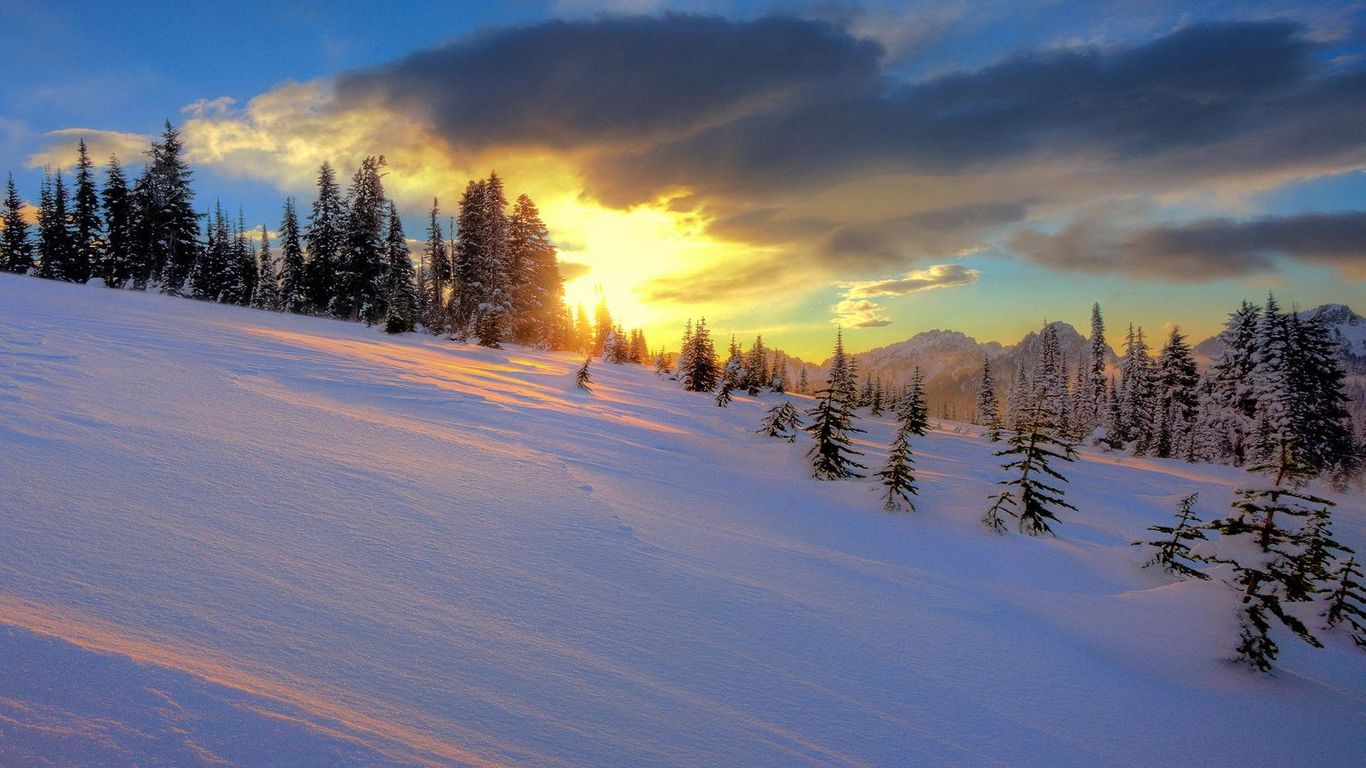 Snowy Hills In The Sunset Wallpaper