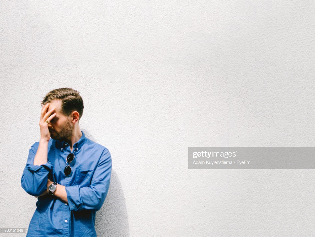 Troubled Man Against White Background Stock Photo Getty Image