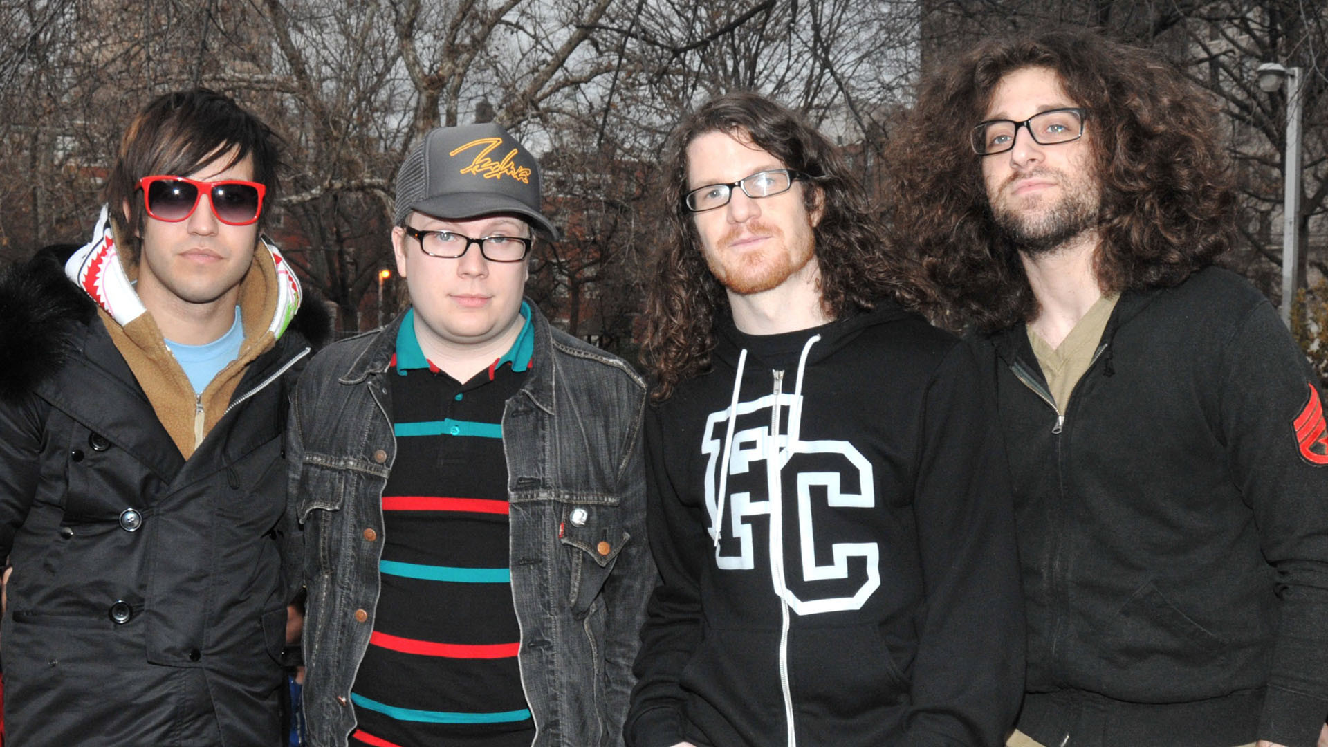 Fall Out Boy band members posing for a photo
