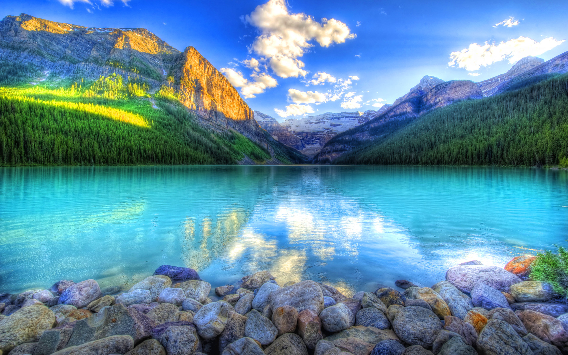 Stunning turquoise lake nestled amidst majestic mountains, perfect for a scenic computer wallpaper